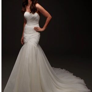 New with tags. Elegant White Wedding Dress Impression Bridal